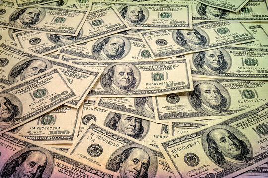 One hundred dollars. Lot of money supply. US dollars banknotes background. Hundred dollar bills. American currency.  Toned image