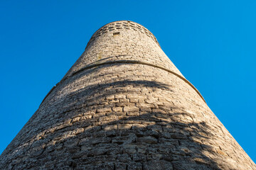 View of the medieval tower of Roccaverano, small city in the hilly region of Langhe (Piedmont, Northern Italy); this area is world famous for valuable wines and hazelnuts productions.