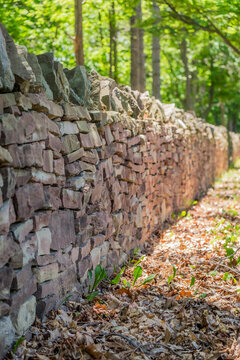 Looking down a dry laid stone wall Niagara on the Lake Ontario Canada.