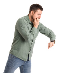 Handsome man with wristwatch biting nails on white background