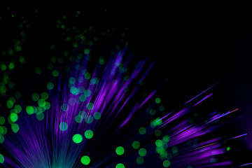 Luminous optical fiber. Fantastic backdrop of illuminated neon purple fiber optic lines and glowing...