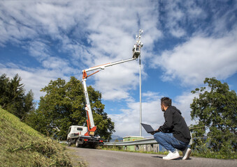 Maintenance and installation of wiring for telephone, television and fast internet connection. Workers at work for the setting and positioning of the new generation plant.