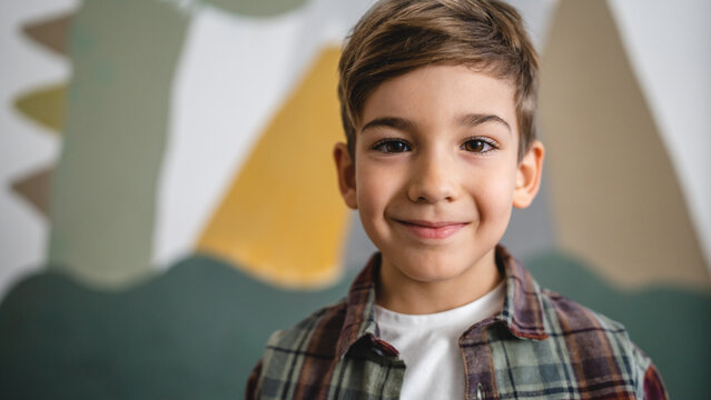 One boy caucasian child six years old kid in his room at home portrait