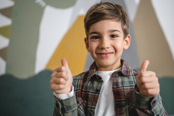 One boy caucasian child six years old kid in his room at home portrait