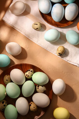 Composition with beautiful painted and natural Easter eggs on color background