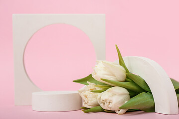 Podiums with white tulips on pink background. Hello spring