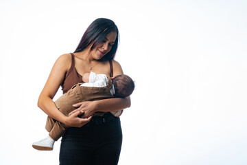 young mother breastfeeding her baby. Single mom holding her son in her arms. Simple family mother...