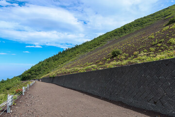 Mt Fuji trail between the 5th and 6th station on Fujiyoshida route with blue sky in Fujiyoshida, Yamanashi, Japan. August 3, 2022