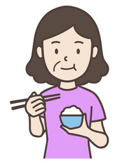 お茶碗を持ってご飯を食べる中年女性、おばさん