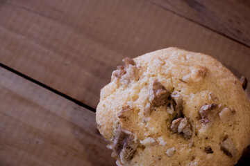 Close up view of walnuts and muffin on wooden planks.