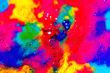 Splash of liquid colored ink, closeup macro. Abstract colorful delightful beautiful artistic background wallpapers.
