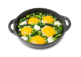 Frying pan with green shakshuka isolated on white