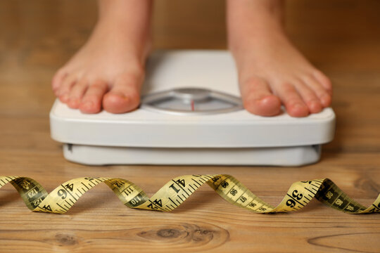 Weighing scales with measuring tape weight loss Vector Image