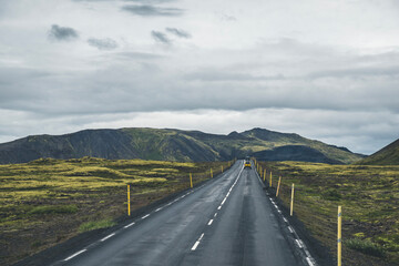 Empty road or highway in the natural environment of Iceland on a cloudy day
