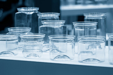 Closeup the group of jars glassware in the light blue scene.