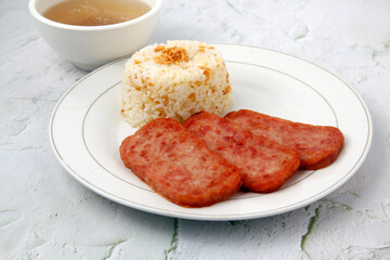 Freshly cooked slices of Spam and fried rice