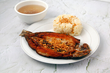 Freshly cooked Filipino food called fried bangus or milkfish and fried rice