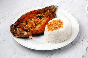 Freshly cooked Filipino food called fried bangus or milkfish and fried rice