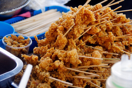 Freshly cooked Filipino street food called Bato bato or fried chicken gizzard.