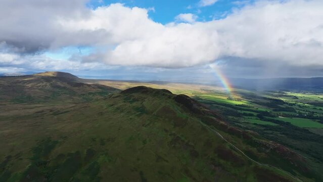 Conic Hill Aerial View with Rainbow in the Background. Next to Loch Lomond in Scotland