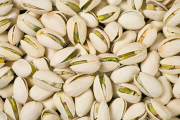 Closeup of pistachio nuts texture background. 