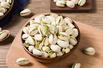 Pistachio nuts on wooden table