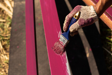 Rust-proof painted steel pipes in the factory. Red iron pipe. Paint the fence of the house.