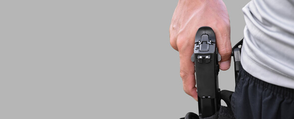 Isolated 9mm pistol gun holding in right hand of gun shooter with clipping paths, copy space.