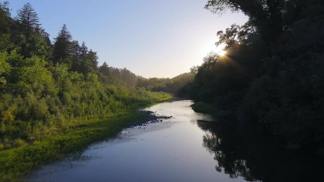 Flying Over Russian River In Del Rio Woods Regional Park On A Sunny Morning In Healdsburg, California, USA. low aerial