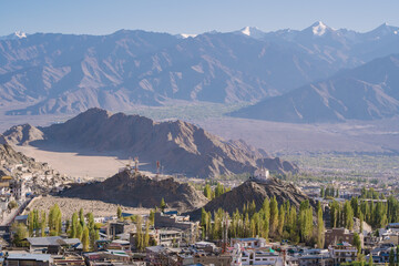Leh town seen from above with many houses and mountains surrounded at Ladakh, in the Indian...