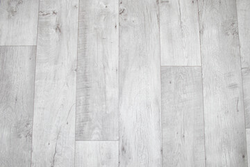 White linoleum with a wood texture. Types of floor coverings.