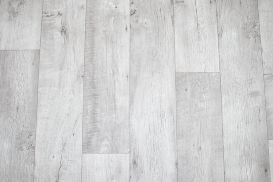 White linoleum with a wood texture. Types of floor coverings.