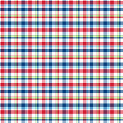 Seamless red and blue, green checkered plaid fabric pattern texture. Stripes crossed horizontal and vertical lines. Seamless checkered picnic pattern	