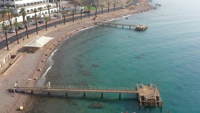 Turquoise wooden pavement gripped at princess beach Eilat
