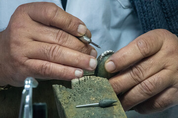 Jeweler working with hands
