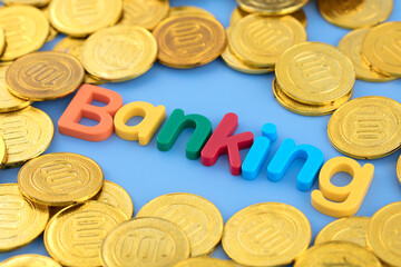 The English word Banking is surrounded by gold coins