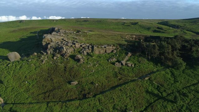Establishing Drone Shot Towards Cow and Calf Rock Formation on Ilkley Moor at Golden Hour West Yorkshire UK