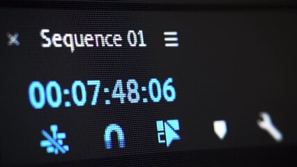 Video editing. Playhead position indicator. Sequence playing forward. Screen close up