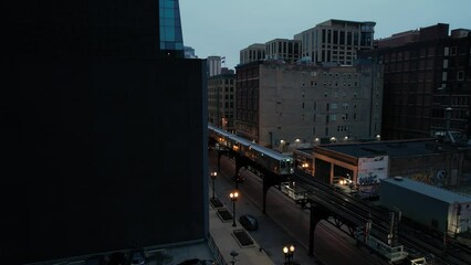 Elevated Train Passing Through Downtown City Center In The Evening Drone.