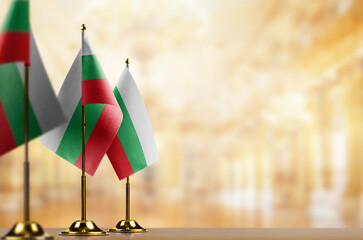 Small flags of the Bulgaria on an abstract blurry background