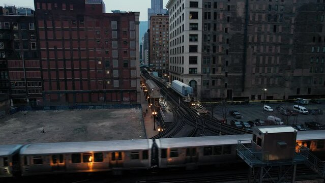 Elevated Subway Train Passing Through City Center At Dusk Drone.