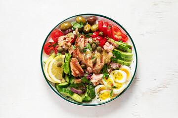 Tuna salad with lettuce, eggs and tomatoes.