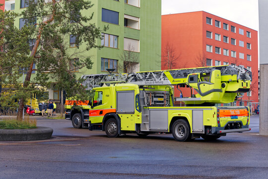 Parked fire engines of city firefighter department at City of Zürich district Oerlikon on a blue cloudy winter day. Photo taken January 31st, 2023, Zurich, Switzerland.