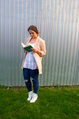 young beautiful woman in a jacket and jeans