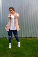 young beautiful woman in a jacket and jeans