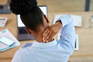 Black woman, neck pain and fatigue at office desk stretching or massage while tired or burnout....