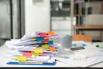 Extremely close up the stacking of office working documents with paper clip folders.