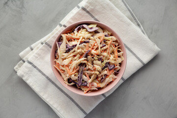 Homemade Classic Southern Coleslaw in a pink Bowl, top view. Flat lay, overhead, from above.