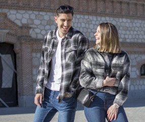 Fototapeta premium A portrait of happy couple having fun outdoors