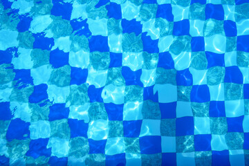 View from above into a pool with blue white flow. Background for summer and vacation. The...